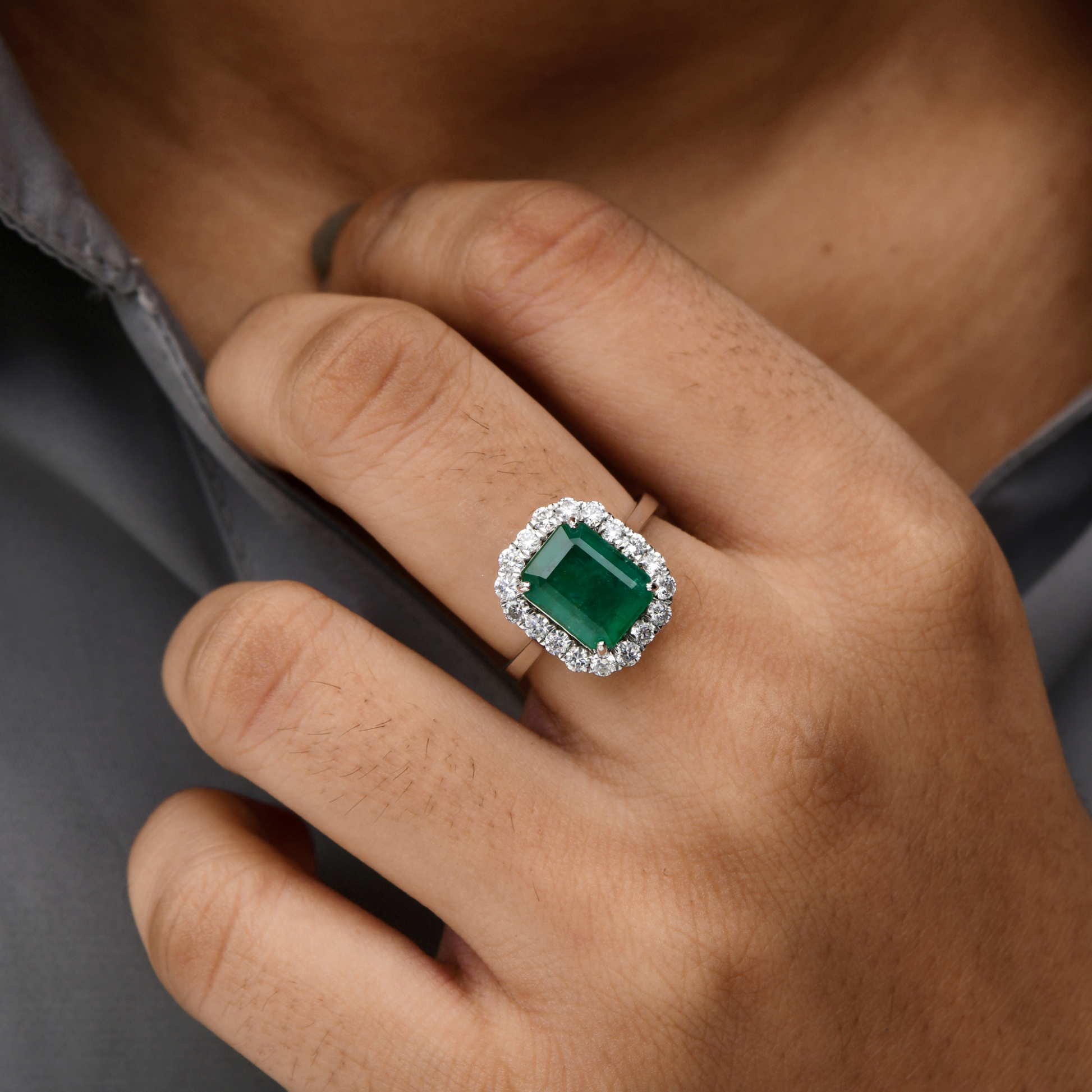 Zambian Emerald Centerpiece Ring with Diamond Halo in Fine Gold