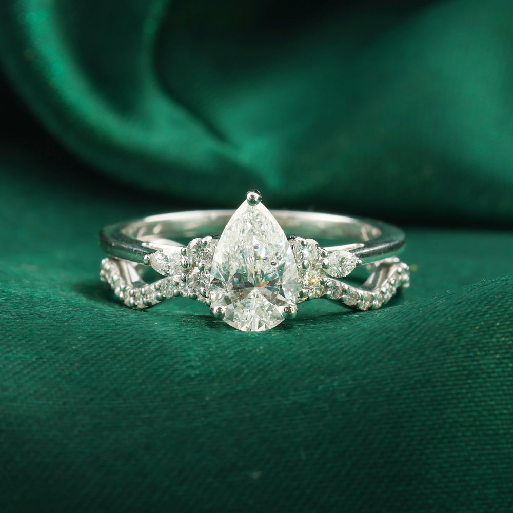 Statement Pear Cut Diamond Engagement Ring with Matching Curved Band statement pear cut diamond engagement ring with matching curved band