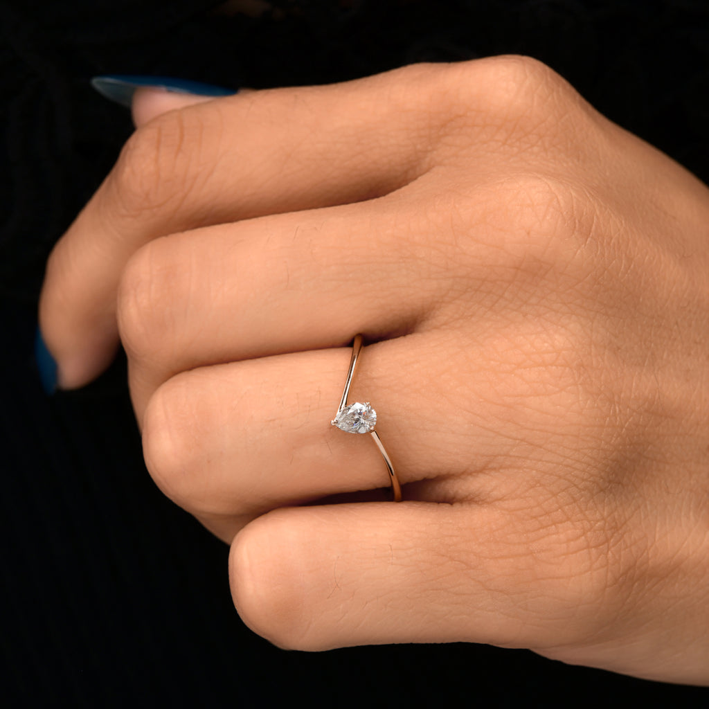 Minimal Pear Cut Natural Diamond Solitaire Ring in Fine Gold