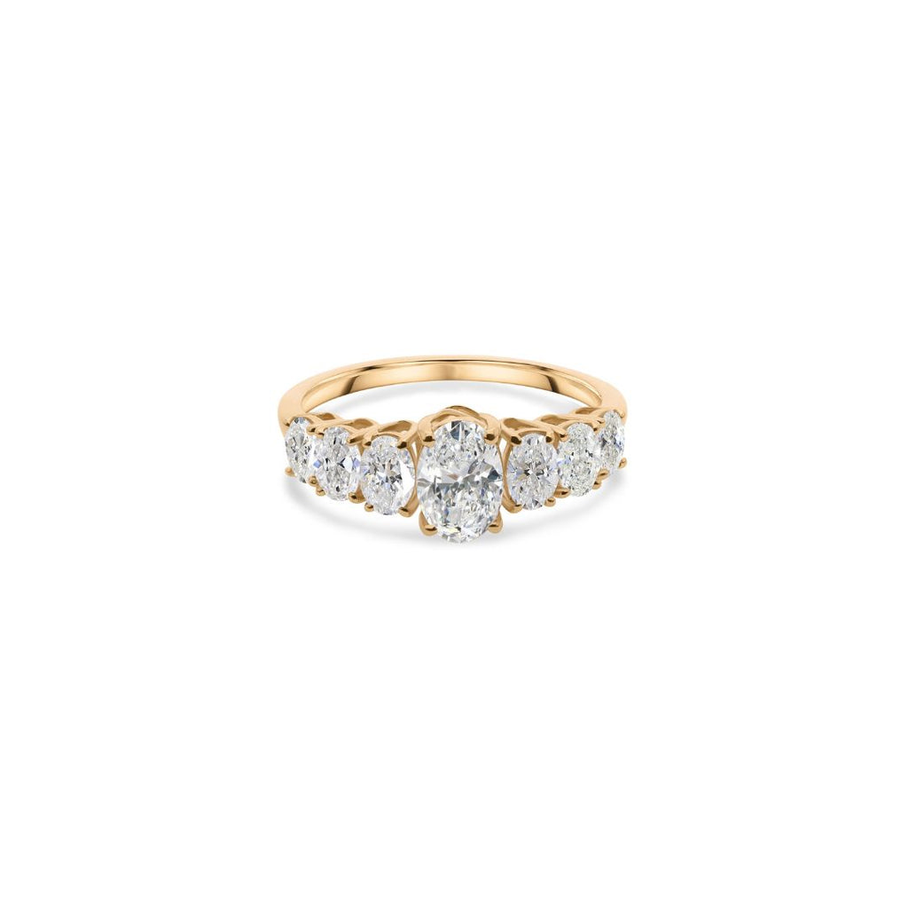 Timeless Oval Natural Diamond Ring in Gold with Graduated Side Stones