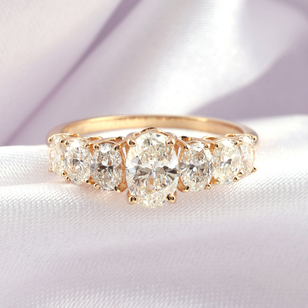 Timeless Oval Natural Diamond Ring in Gold with Graduated Side Stones