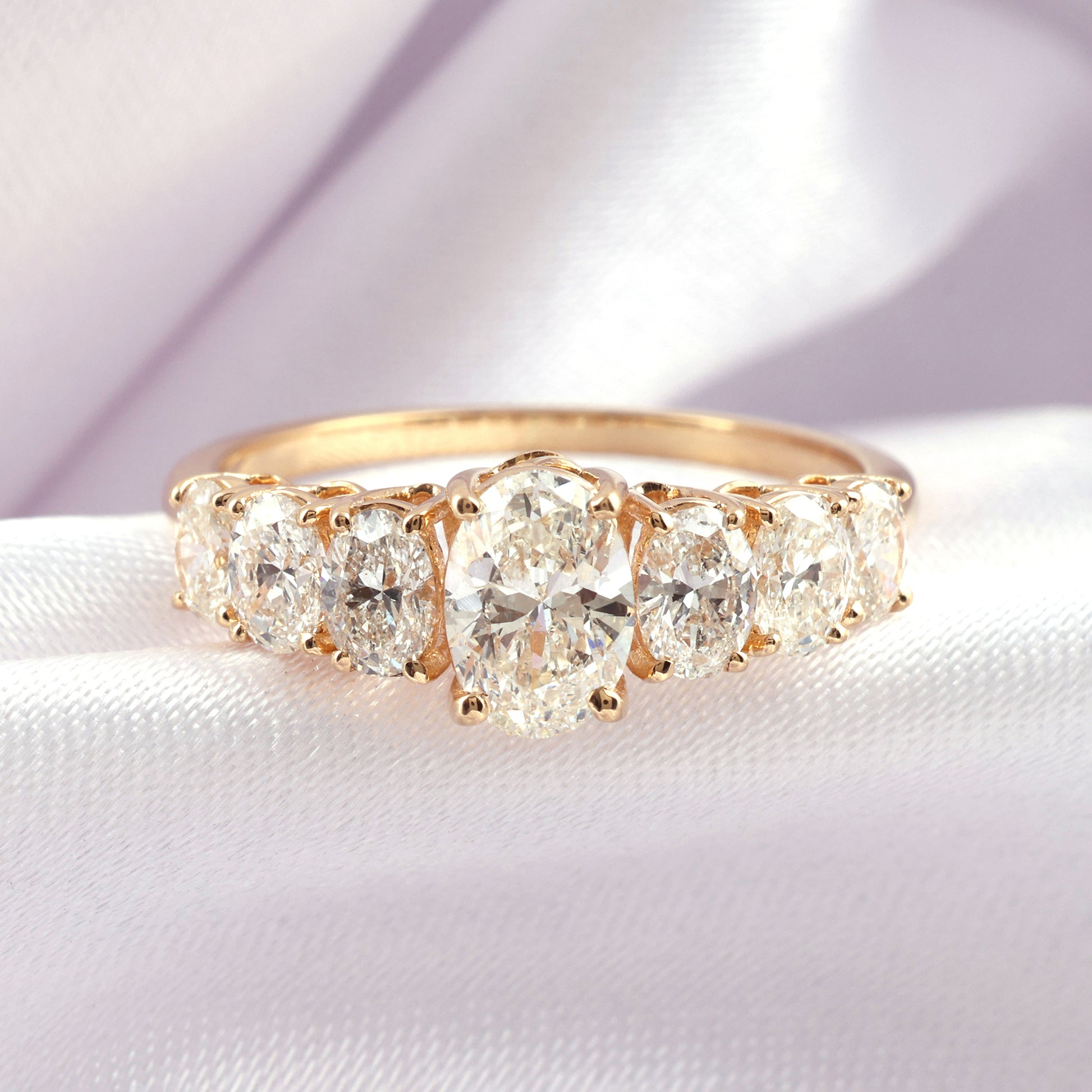 Timeless Oval Natural Diamond Ring in Gold with Graduated Side Stones