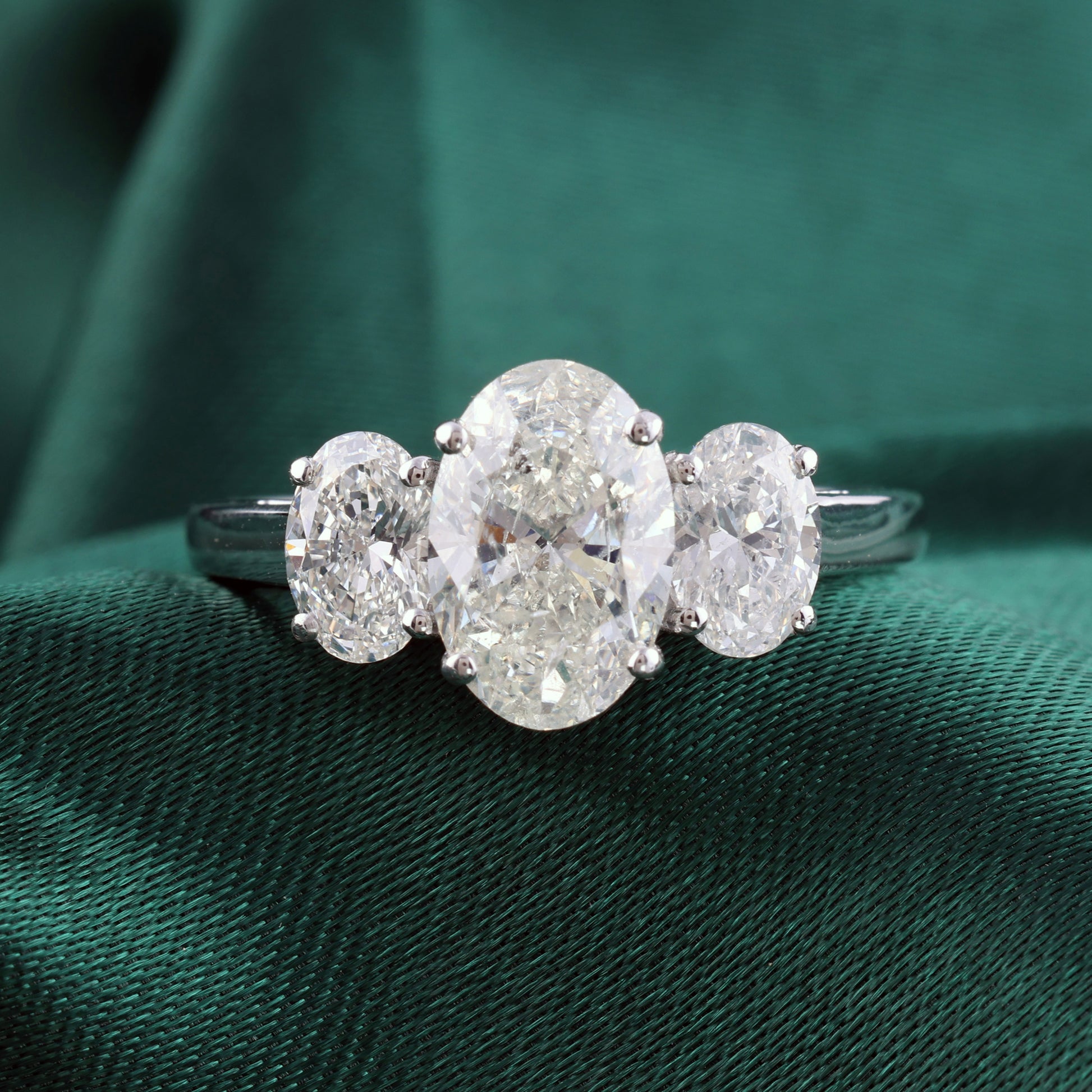 Oval Cut Diamond Three Stone Engagement Ring with Fine Gold Band