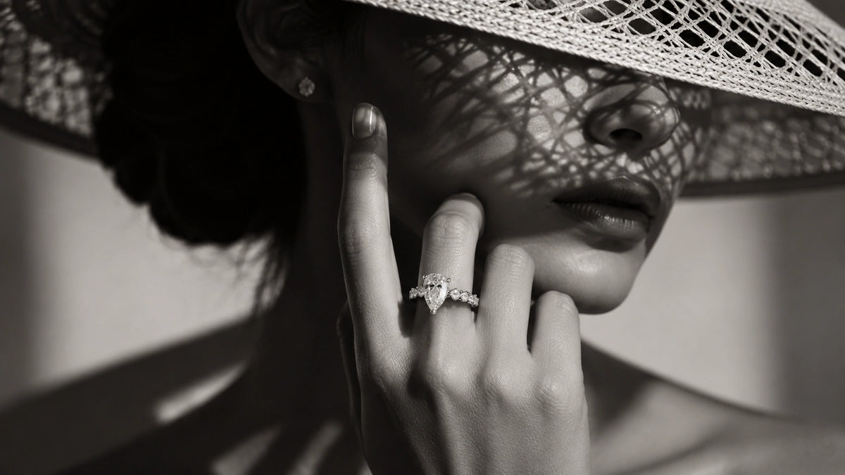 Woman wearing a pear-shaped diamond engagement ring